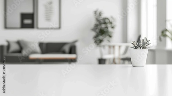 Fototapeta Minimalist home interior with plant on table. Bright and airy living room with white table in focus, perfect for product placement.
