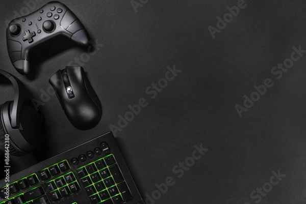 Fototapeta Orange lit keyboard by game controller and mouse