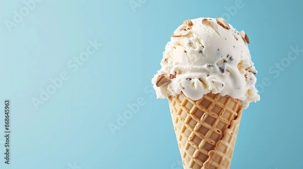 Fototapeta Almond ice cream cone on a sky blue background very detailed and realistic shape