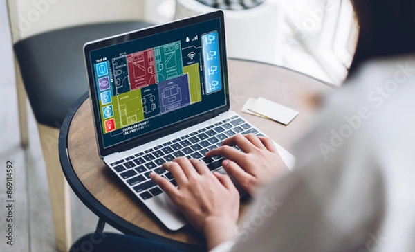 Fototapeta Person using and convenience a laptop to control a smart home system screen displays various smart home icons and functions, technology in modern living, smart technology into everyday life at home