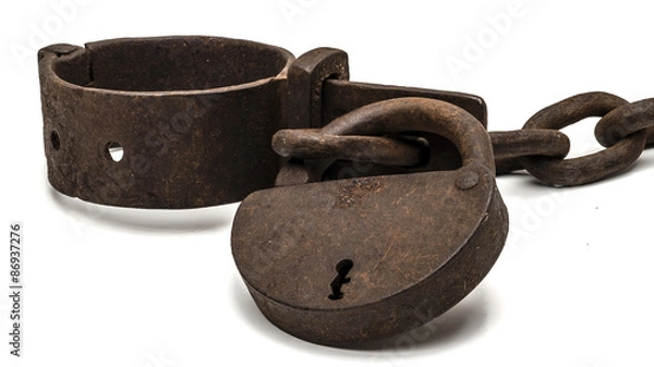 Fototapeta Rusty old shackles with padlock used for locking up prisoners or slaves between 1600 and 1800.