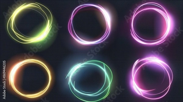 Fototapeta A modern realistic illustration of neon yellow, green, pink rings glowing in darkness, swirling energy in a cloud of gas, shimmering particles on a transparent background.