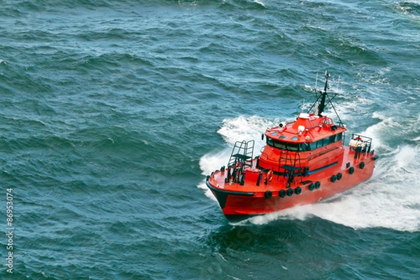 Obraz small pilot boat  sailing