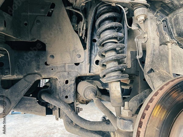 Fototapeta Front shock absorber of pickup truck Car undercarriage that has been heavily used