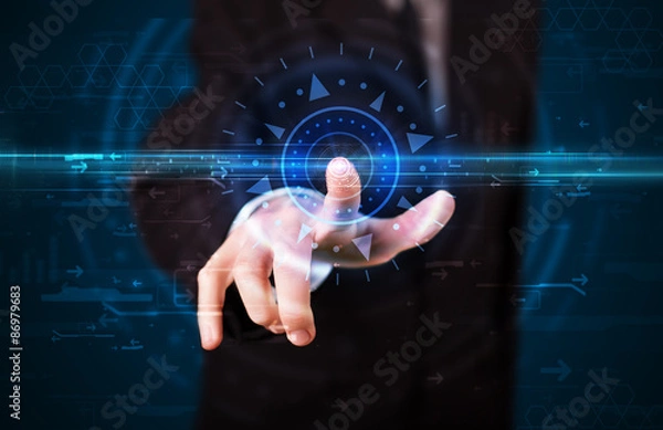 Fototapeta Handsome tech guy pressing high technology control panel screen