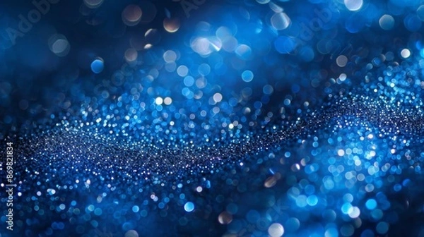 Fototapeta Bokeh background with sapphire glow. Unfocused royal blue glow. Crystal drops and sequins wallpaper. Holiday texture confetti wallpaper.
