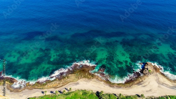 Fototapeta Birdseye aerial view of the Northern Puerto Rico coastline, taken in Arecibo, PR. 