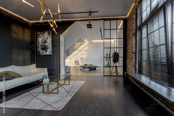 Obraz minimalistic stylish interior of luxury apartment with white stylish bedroom and dark living room. modern apartments with an open layout during the day without people and amazing sun rays