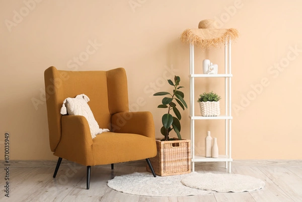 Fototapeta Armchair, rack and wicker box in interior of living room