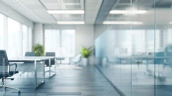 Fototapeta Beautiful, blurred background of modern office interior in gray tones with glass windows, glass partitions.