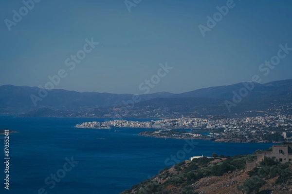 Obraz Panoramic view of Agios Nikolaos, Crete's Island, Greece. A scenic blend of sea, sky, and urban charm