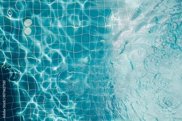 Fototapeta Top view of clear water surface, water is rippling on swimming pool with blue grid mosaic tiles