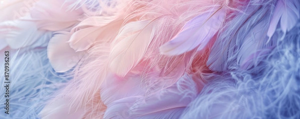 Fototapeta A close-up of delicate, fluffy feathers in pastel shades of pink, lavender, and baby blue. The soft hues and textures evoke a sense of calm and lightness.
