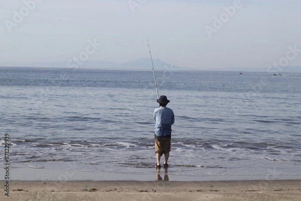 Obraz 海で釣りをする女性