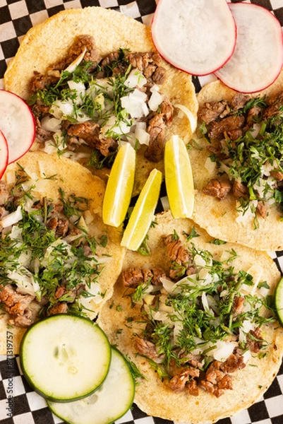 Obraz Mexican tacos with condiments and vegetables