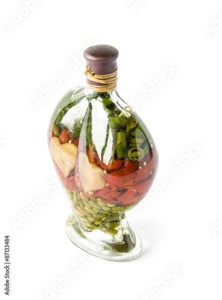 Obraz Decorative salted seeds in a glass bottle isolated on white