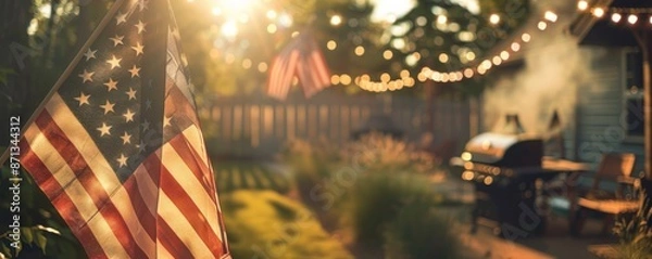 Fototapeta American flag hanging in backyard with string lights and barbecue grill, sunset family gathering concept