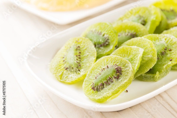 Obraz slices of dried kiwi on the sacking background