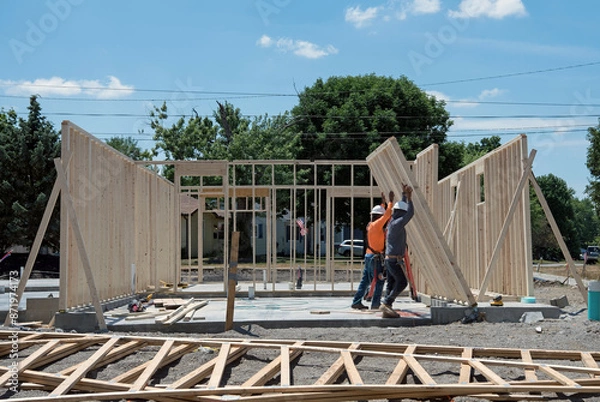 Obraz Construction Workers Raise Studded Wall Unit
