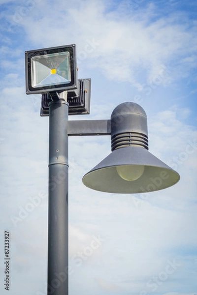 Obraz Lamp post against blue sky