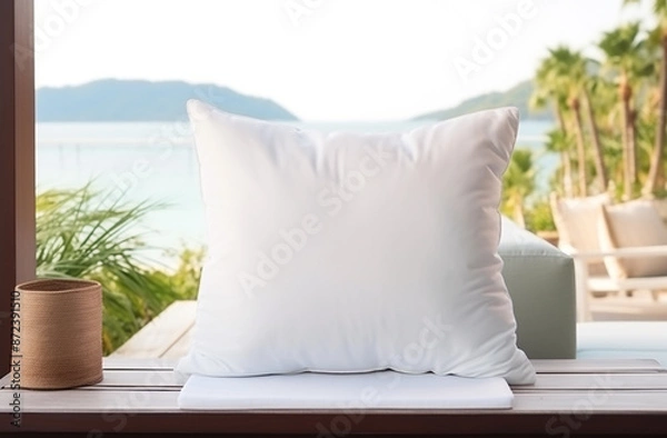 Fototapeta White blank pillow mockup coastal style interior lying on a sofa