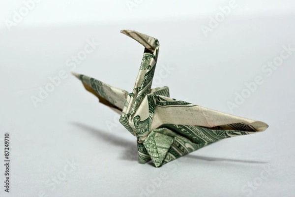 Fototapeta origami crane from a money note