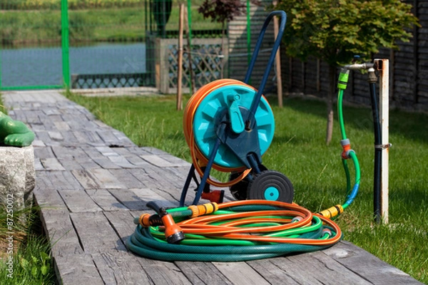 Fototapeta garden hose on wheels