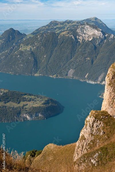 Fototapeta Lake in a valley seen from Fronalpstock summit in Switzerland. Swiss Alps iconic view