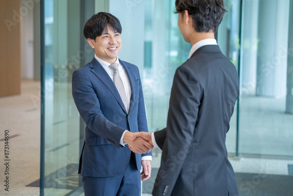 Obraz 握手をするビジネスマン