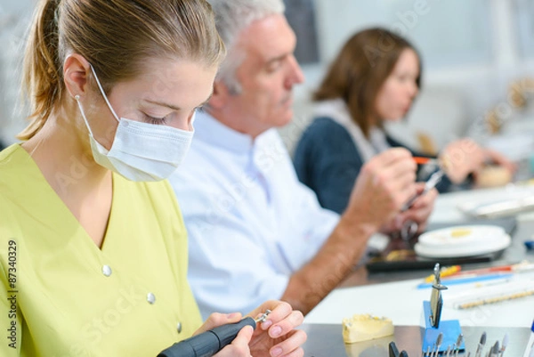 Fototapeta Busy dentist with a patient
