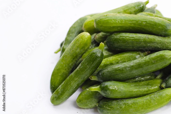 Obraz Mini cucumbers on white background.
