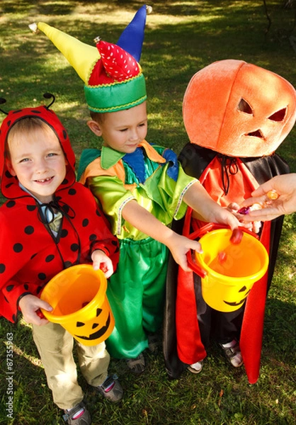 Obraz Three boys are getting their candies