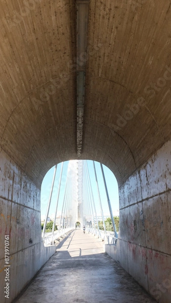 Fototapeta Pedestrian access tunnel. Ride for people through a tunnel.