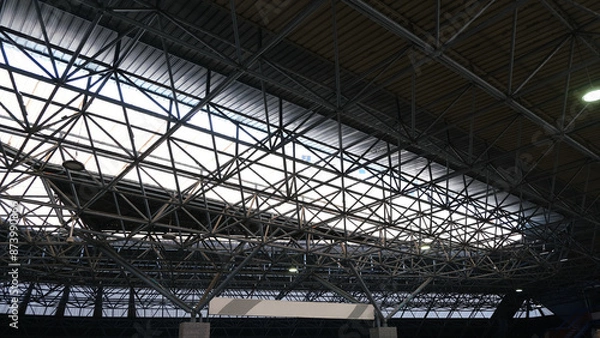 Fototapeta Metal ship cover. Metal structure to cover large space. Metal trusses for roofs. Type of architecture to lighten roofs. 