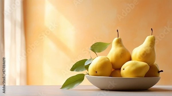 Fototapeta A bowl of yellow pears