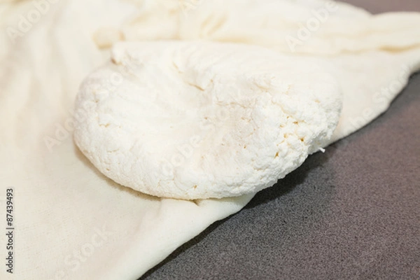 Fototapeta Closeup of whole paneer on buttercloth