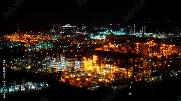 Fototapeta A night view of an industrial complex where the lights are not turned off 24 hours a day.