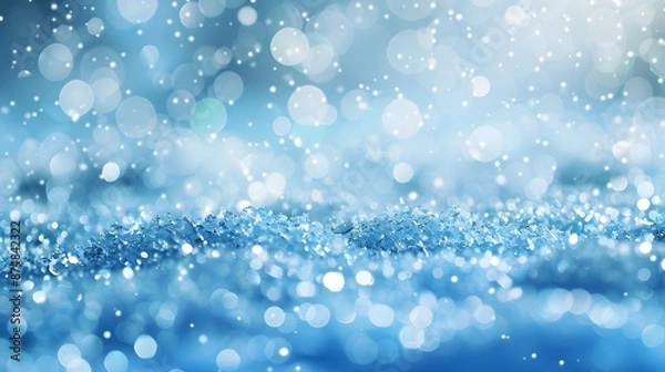 Fototapeta Light snow bokeh background on shiny glitter light blue snow winter for Christmas festive background. 