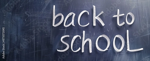 Fototapeta A blackboard with the words "back to school" written on it against a white background,