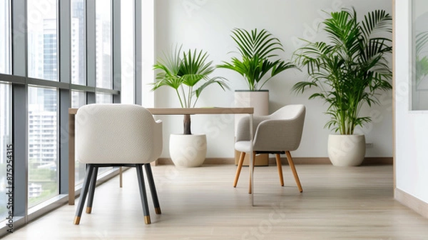 Fototapeta A modern office space with large windows and lush green plants, creating a serene and inviting atmosphere.