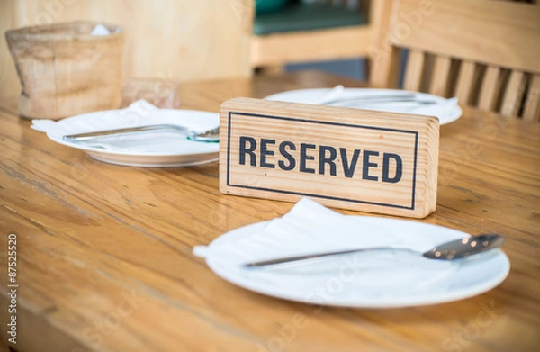 Obraz Reserved sign on a table in restaurant