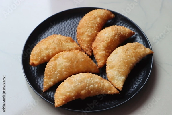 Obraz Karanji or gujia, Kajjikayalu, Indian festival food, stuffed with coconut stuffing