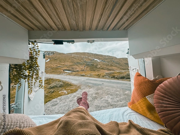 Fototapeta Vanlife back view from the van overseeing mountains in Norway