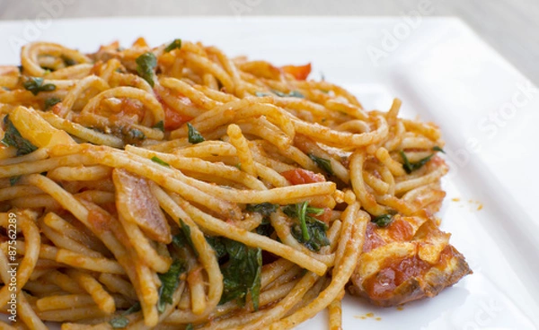 Fototapeta Vegan spaghetti with tofu and pepper delicious on plate