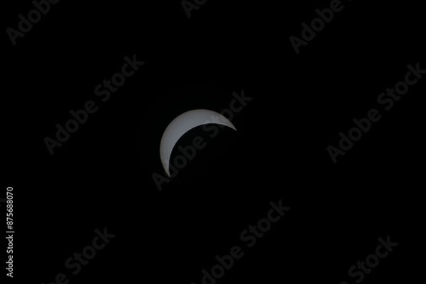 Obraz Total eclipse waxing as moon begins to cover the sun