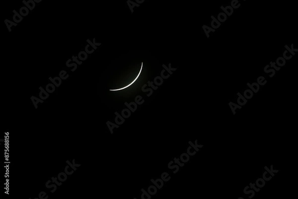 Obraz Total eclipse waning as moon begins to uncover the sun