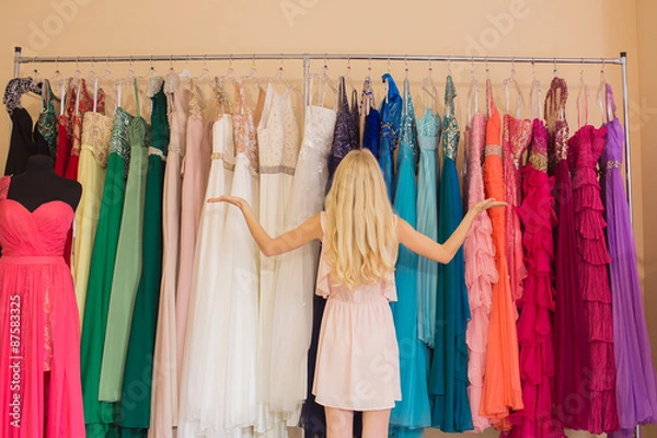 Obraz Young woman in dress shop