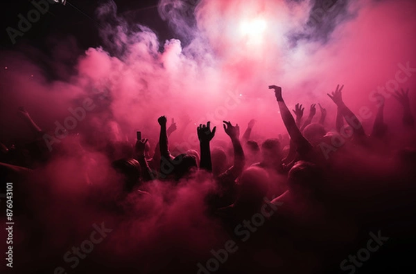Obraz Enthusiastic crowd dancing and enjoying music in a club with pink lighting and smoke effects, creating a lively atmosphere