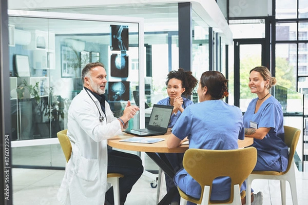 Fototapeta Doctor, laptop and discussion with nurse in office for healthcare research, feedback and brainstorming. Medical, people and xray with meeting for neurology, internship and review of treatment plan