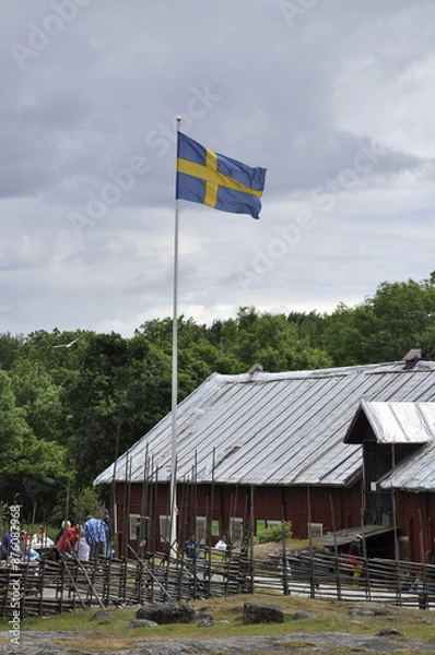 Obraz The Swedish flag on a windy, cloudy day.